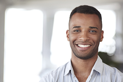 Young Man with Beard Stubble Smiling iStock 000078214675 width of 400 pixels